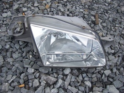 REFLEKTOR PRAWY MAZDA 323